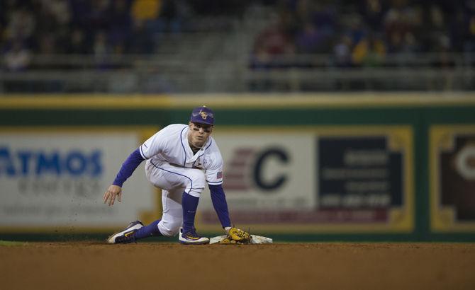 LSU junior infielder Cole Freeman (22) tags second base during the Tigers' 6-0 victory against Sacramento St. on Friday, Feb. 26, 2016 in Alex Box Stadium.