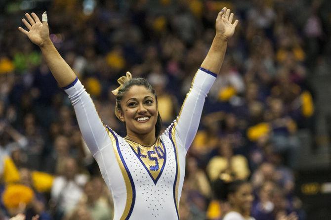 LSU all-around senior Jessica Savona celebrates her floor routine score Friday, March 4, 2016, during the Tigers' 197.925-196.225 victory against Alabama in the PMAC.