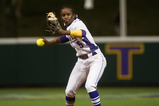 LSU junior infielder Constance Quinn (5) throws the ball to first base during LSU's 6-2 victory against the University of Alabama on March 11, 2016 at Tiger Park