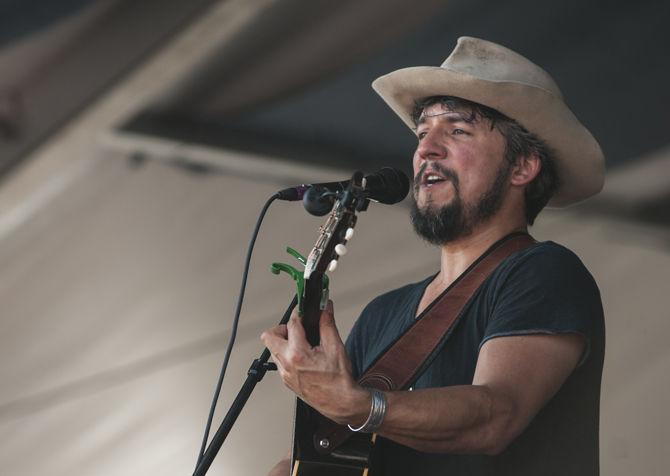 Cruz Contreras of The Black Lillies performs Friday, April 22, 2016 on the Sheraton New Orleans Fais Do-Do Stage during the first day of the New Orleans Jazz &amp; Heritage Festival.