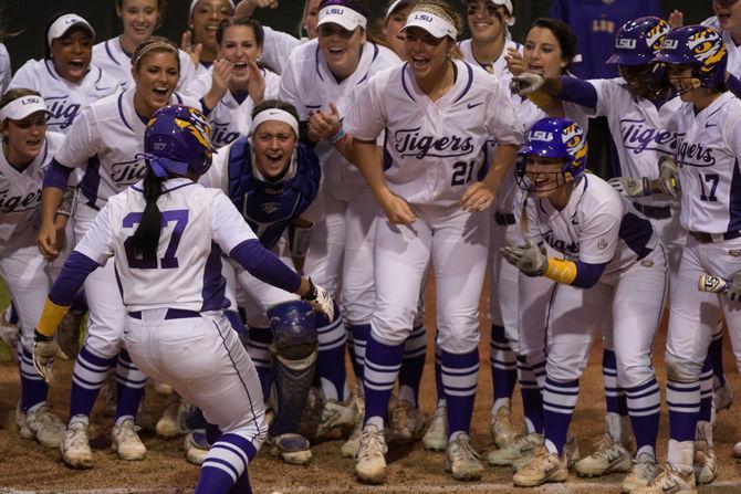 Senior infielder Bianka Bell (27) is greeted by her teammate after her home run during LSU's 6-2 victory against the University of Alabama on March 11, 2016 at Tiger Park