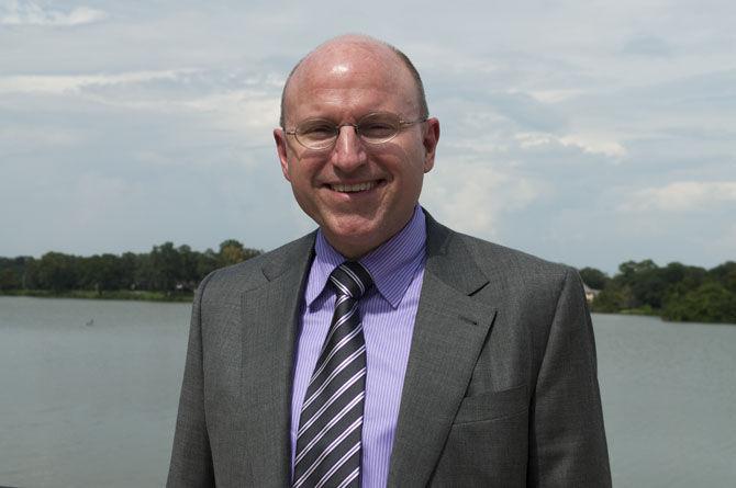 LSU Foundation's President and CEO Stephen Moret stands beside the LSU Lakes on Wednesday, Sept. 9, 2015, on LSU's campus.