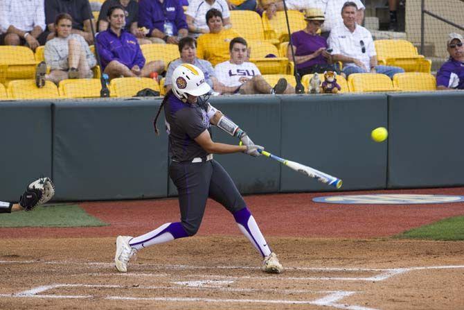 LSU senior catcher, Kellsi Kloss (77), hits the ball during the Tigers' 5-2 victory against McNeese State on Tuesday, April 26, 2016 at Tiger Park.