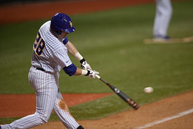 LSU junior catcher Jordan Romero (28) bats during LSU's 6-3 win against Louisiana Tech on Tuesday, March 8, 2016 at Alex Box Stadium