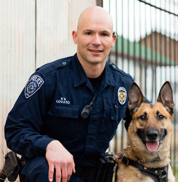 This photo provided by the Unified&#160;Police&#160;Department shows Unified&#160;Police&#160;K9 Aldo and Officer Luis Lovato. Officials say a Unified&#160;Police&#160;SWAT team was called to serve an arrest warrant on Wednesday, April 27, 2016, when a gunfight ensued. As officers entered the home with a K9 named Aldo, they came under and returned fire. Aldo was fatally wounded. (Unified&#160;Police&#160;Department via AP)