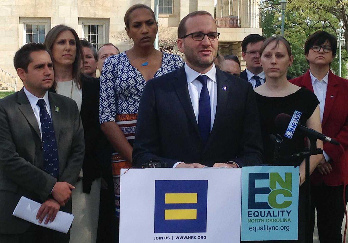 FILE - In this March 30, 2016 file photo, Human Rights Campaign Executive Director Chad Griffin, center, speaks at a news conference at the old state Capitol Building in Raleigh, N.C. Griffin was among several LGBT leaders who headed to the state to join in protests and plot strategy for trying to overturn a new law limiting bathroom options for transgender people. Stung by setbacks related to their access to public restrooms, transgender Americans are taking steps to play a more prominent and vocal role in a nationwide campaign to curtail discrimination against them. (AP Photo/Gary Robertson, File)