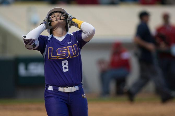 LSU sophmore outfielder Emily Griggs (8) walks back to the dugout after getting out during LSU's 2-0 victory against the Nicholls State University on Tuesday, March 22, 2016 at Tiger Park