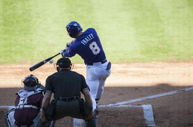 LSU outfielder Jake Fraley (8) strikes the ball on Saturday, March 5, 2016, during the Tigers' 15-1 win against Fordham at Alex Box Stadium.