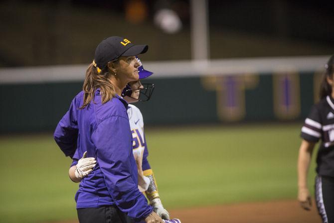 LSU freshman infielder Amber Serrett (17) hugs head coach Beth Torina during the Tigers' 8-0 victory against ULM on Tuesday, Mar. 1, 2016 in Tiger Park.