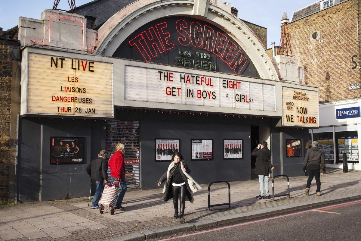 In this Jan 10, 2016 photo, locals walk past the Screen on the Green cinema in London. With a fabulous neon facade, it hosts movies and live events. It&#8217;s one of the oldest cinemas in the UK. The Clash, Sex Pistols and Buzzcocks played together there on the night Aug. 29, 1976. It was the end of the long, hot summer when punk was born. (Jonathan Elderfield via AP)