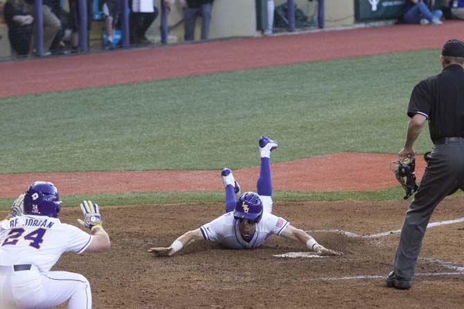 LSU sophomore infield, Greg Deichmann (07), slides in to home during the Tigers&#8217; 13-4 victory against Vanderbilt on Thursday. April 04, 2016 in the Alex Box.