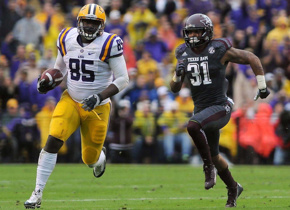 LSU tight end Dillon Gordon (85) runs past Texas A&amp;M junior defensive back Howard Matthews (31) on Saturday Nov. 23, 2013 during the Tigers' 34-10 victory against Texas A&amp;M in Tiger Stadium.