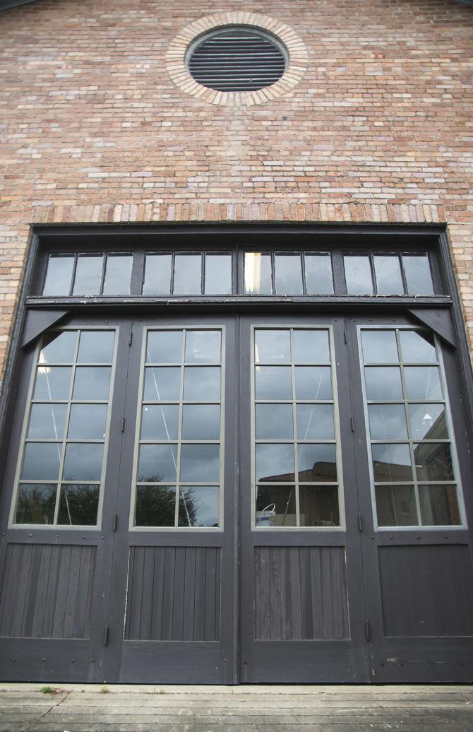 Master carpenters Kent Clark and Jeff Mitchell work towards creating new doors for the Studio Arts Building. The doors are replications of the originals with small modifications like insulated windows.