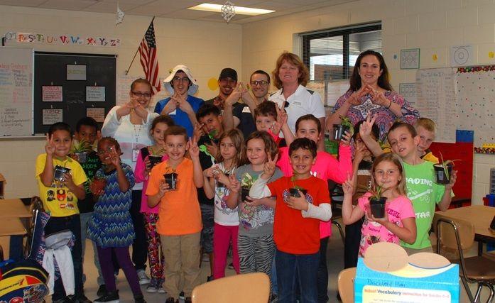 As part of the Green Initiative for their non-profit Peace by Peace, University alumni and brothers Garrett and Russell Collins donated plants to a Discovery Elementary School class in Deltona, Florida.