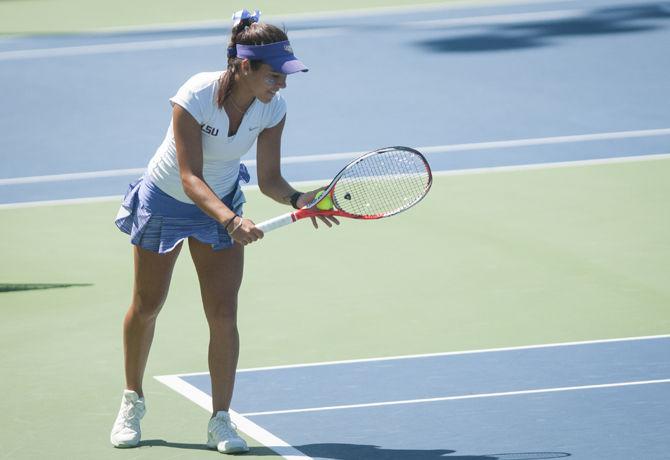 LSU sports administration junior Joana Vale Costa gets ready to serve on Friday, April 23, 2016, during the women's doubles tennis match against Florida at the LSU Tennis Complex