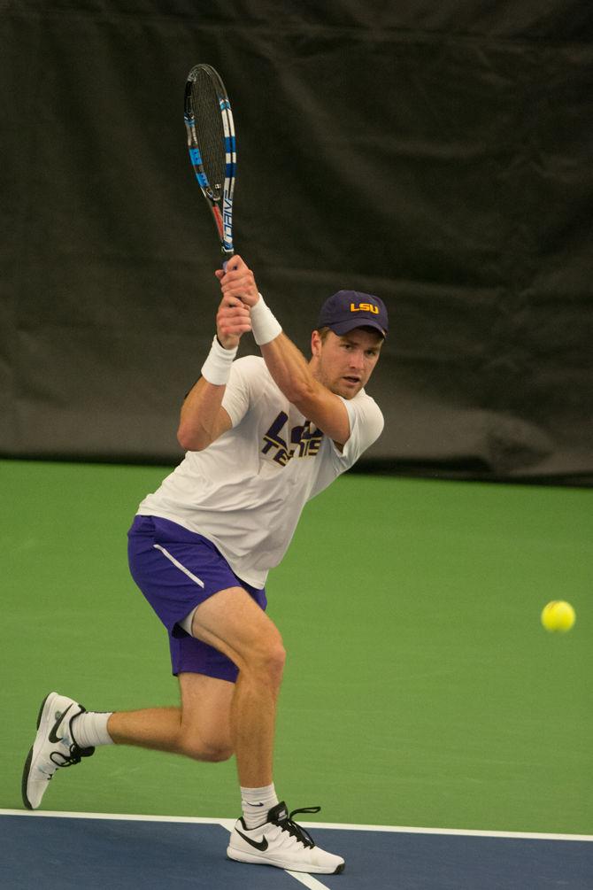 LSU junior Jordan Daigle returns the ball during LSU's defeat against the University of Alabama on Friday, March 18, 2016 at the LSU Tennis Facility