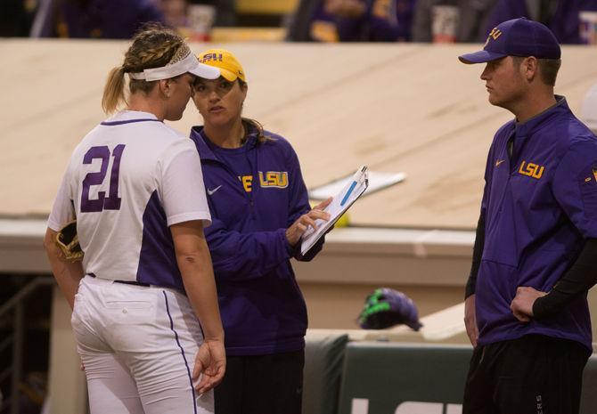 LSU sophmore pitcher Carley Hoover (21) speaks with head coach Beth Torina during LSU's 6-2 victory against the University of Alabama on March 11, 2016 at Tiger Park