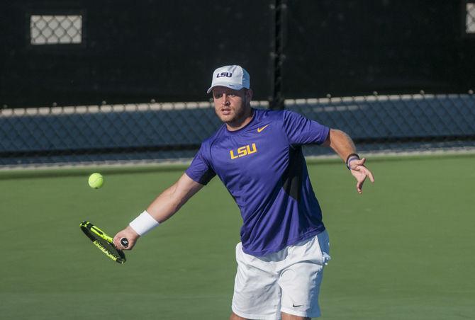 LSU senior Andrew Korinek&#160;returns the ball during the Tigers' match against UNO on Sunday, April 3, 2016 at the LSU Tennis Complex.