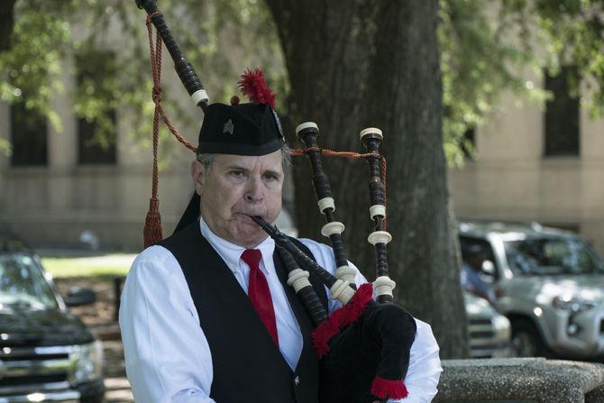 Sherry Smelley&#8217;s graduate social work class celebrates a ceremony to honor and remember military personnel, first responders, and loved ones who have passed away on Monday, Apr. 25, 2016 in the Indian Mounds at LSU.