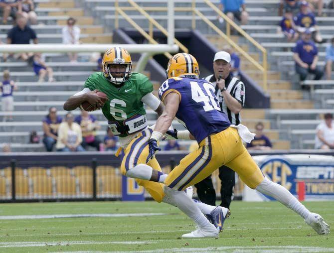 LSU sohpomore quarteback Brandon Harris (6) runs the ball during LSU white squad's 45-6 victory over LSU purple squad during the annual Spring Football game on Saturday, April 18, 2015 in Tiger Stadium.