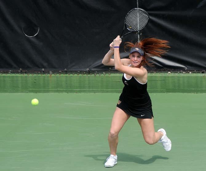 LSU freshman Abigail Owens hits a volley Sunday, March 9, 2014 during the Lady's Tigers' double match against Auburn at W.T. "Dub" Robinson Stadium.