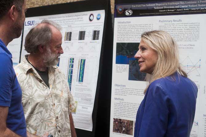 The LSU Department of Geology and Geophysics professors Dr. Barbara Dutrow (right), Dr. Darrell Henry (center), and Dr. Peter Doran (left) go through the poster entries for the Rockstar Poster Competition in Howell-Russel Hall on Thursday April 21, 2016, on LSU campus.