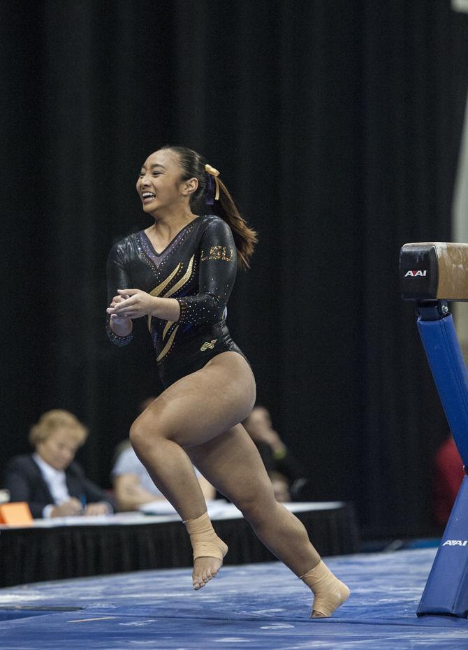 LSU sophomore all-arounder Erin Macadaeg celebrates after her beam performance during the Tigers' second place in NCAA Semifinals Session I with a 197.3375 team score to advance to the Super Six on Friday, Apr. 15, 2016 in Dallas Fort Worth.