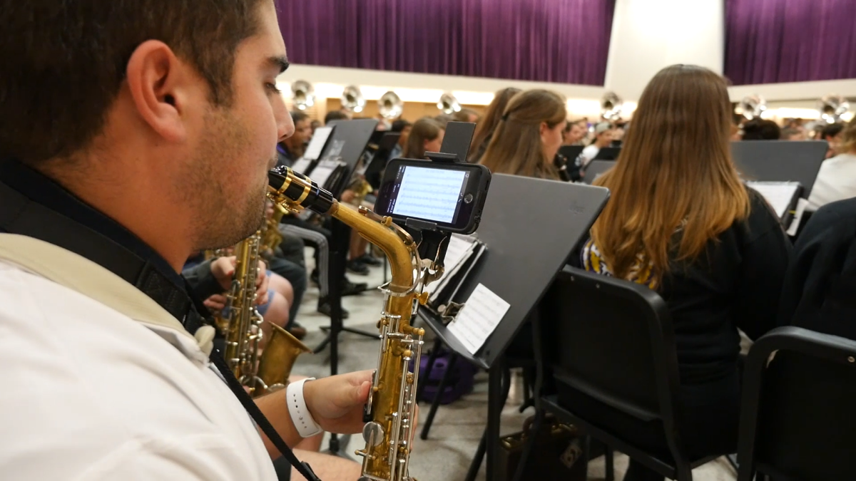 Saxophone section leader Garrett Kessling uses the eFlip during a Tiger Band rehearsal.