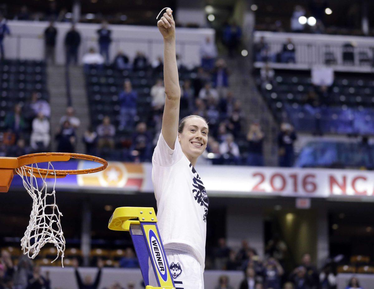 Connecticut's Breanna Stewart (30) celebrates by cutting down the net after Connecticut's 82-51 victory over Syracuse in the championship game at the women's Final Four in the NCAA college basketball tournament Tuesday, April 5, 2016, in Indianapolis. Connecticut won 82-51. (AP Photo/Michael Conroy)