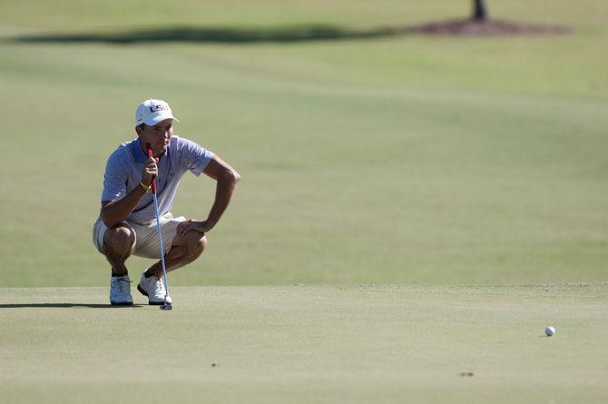 LSU senior golfer Zach Wright reads the green during the David Toms Intercollegiate tournament on Oct. 11, 2015, at the University Club golf course.