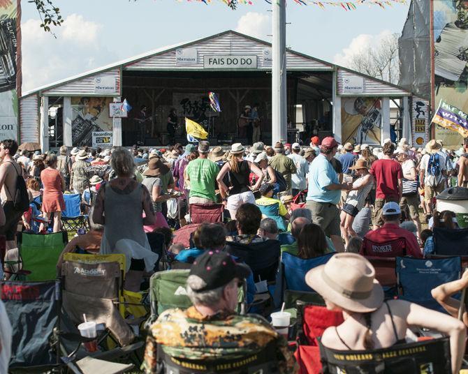 Spectators watch The Black Lillies perform Friday, April 22, 2016 on the Sheraton New Orleans Fais Do-Do Stage during the first day of the New Orleans Jazz &amp; Heritage Festival.