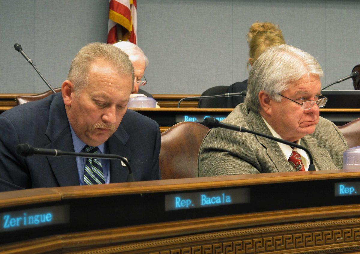 Reps. Jack McFarland, R-Jonesboro, and Steve Pylant, R-Winnsboro, listen to a presentation from Commissioner of Administration Jay Dardenne to the House Appropriations Committee about upcoming budget cuts, on Monday, March 21, 2016, in Baton Rouge, La. (AP Photo/Melinda Deslatte)