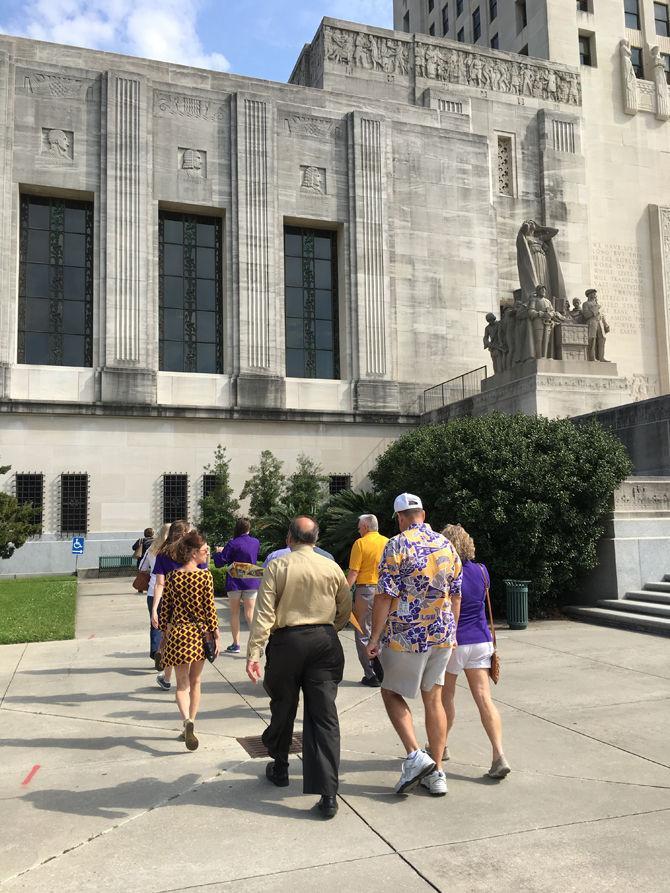 Tiger Band director Roy King's supporters walk into the state Capitol to deliver a change.org petition with roughly 1,500 signatures.