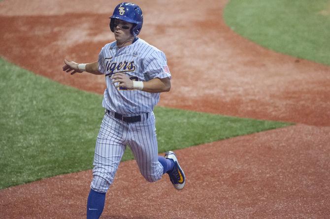 LSU junior infielder Cole Freeman (22) runs home during the Tigers' game against Southeastern on April 20, 2016 in Alex Box Stadium