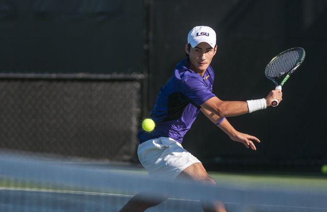 LSU sophomore Simon Freund returns the ball during the Tigers' match against UNO on Sunday, April 3, 2016 at the LSU Tennis Complex.