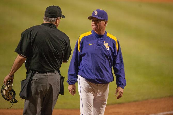 LSU head coach Paul Mainieri speaks with the referie during LSU's 3-2 victory against Vanderilt on Friday, April 8, 2016 at Alex Box Stadium