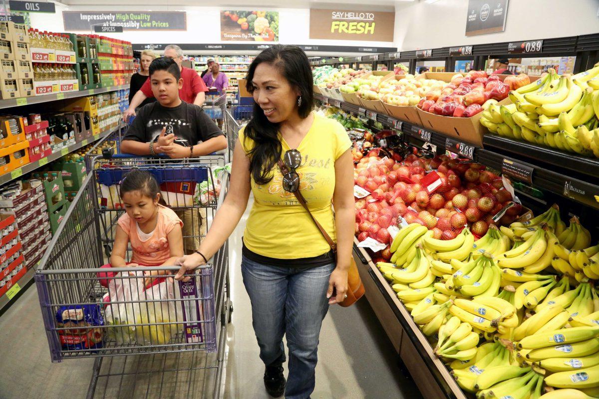 IMAGE DISTRIBUTED FOR ALDI - Grocery shoppers experience ALDI during the grand opening of the first of eight Southern California locations on Thursday, March 24, 2016, in Moreno Valley, Calif. ALDI, one of America's favorite grocery stores, will open approximately 45 stores in Southern California by the end of 2016. (Photo by Casey Rodgers/Invision for ALDI/AP Images)