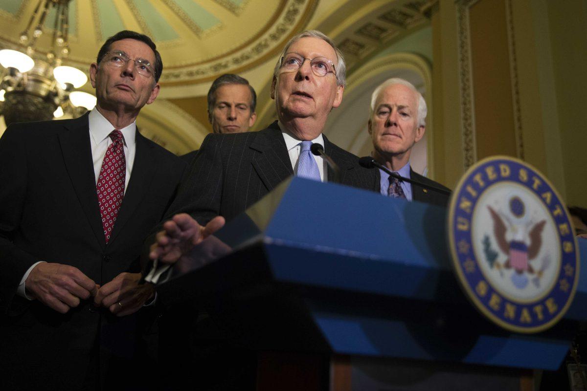 Senate Majority Leader Sen. Mitch McConnell of Ky. speaks on Capitol Hill in Washington, Tuesday, April 12, 2016, following a Republican policy luncheon. From left are, Sen. John Barrasso, R-Wyo., Sen. John Thune, R-S.D., McConnell, and Senate Majority Whip John Cornyn of Texas. (AP Photo/Evan Vucci)