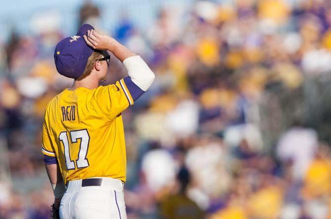 LSU freshman catcher and infielder Chris Reid (17) waits for the pitchers windup during the LSU vs Mississippi State baseball game on Saturday April 23, 2016.