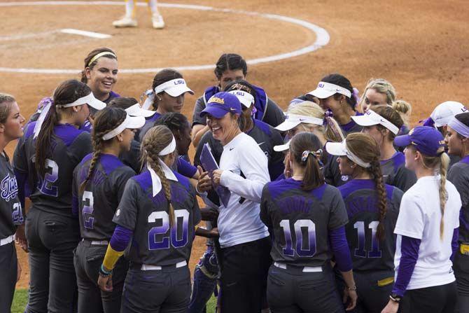 Lady Tigers huddle with their head coach, Beth Torina, during the Tigers' 5-2 victory against McNeese State on Tuesday, April 26, 2016 at Tiger Park.