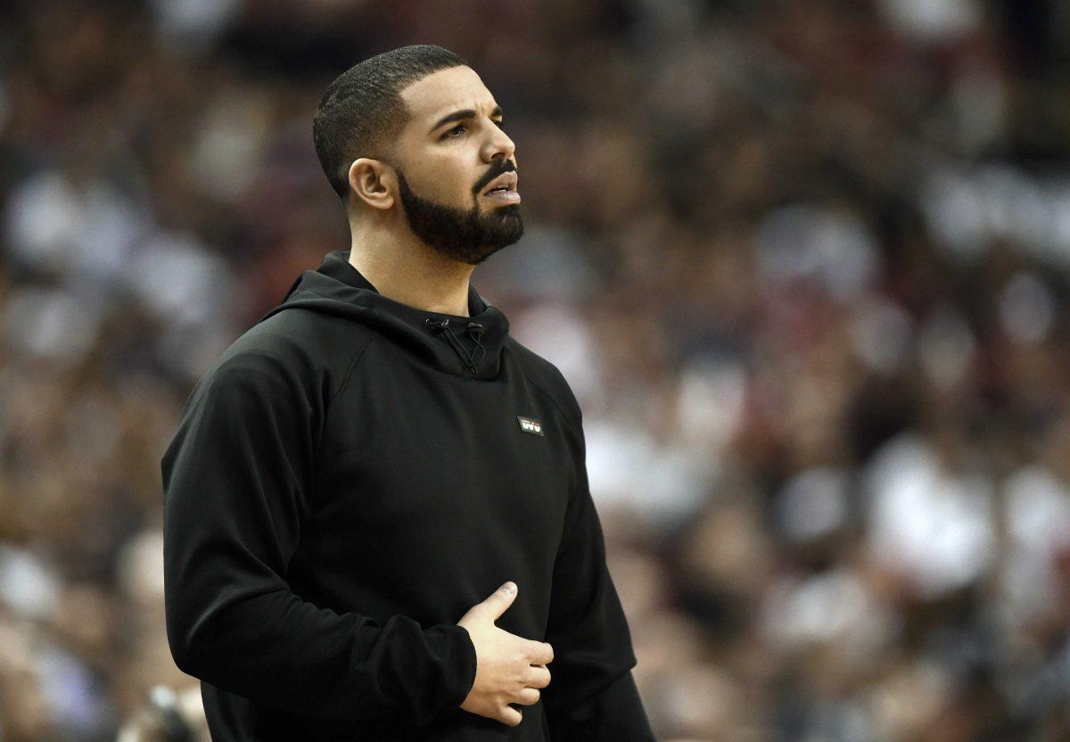 Rapper Drake watches the action between the Indiana Pacers and the Toronto Raptors during the first half of Game 5 of an NBA first-round playoff basketball series, Tuesday, April 26, 2016 in Toronto. (Frank Gunn/The Canadian Press via AP)