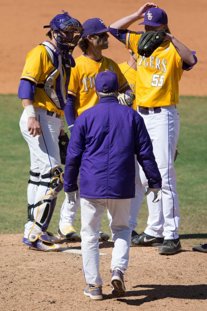 LSU head coach Paul Mainieri talks with his team during LSU's 7-5 victory against the University of Alabama on Sunday, March 20, 2016 at Aleb Box Stadium