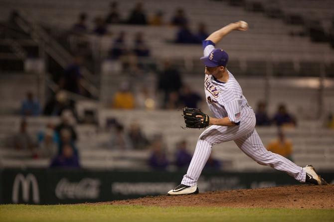 LSU junior pitcher Russell Reynolds (45) pitches during LSU's 7-0 defeat on Tuesday, April 12, 2016 at Alex Box Stadium