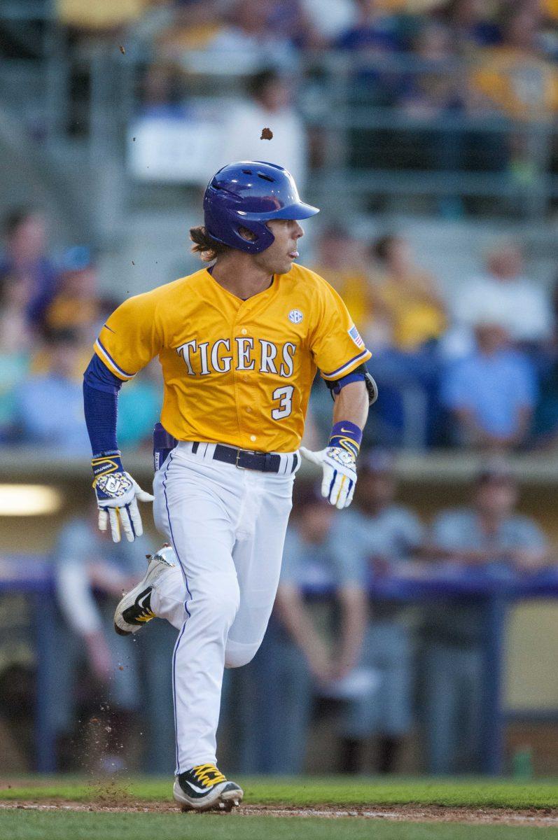 LSU junior infielder Kramer Robertson (3) begins his run to first during the LSU vs Mississippi State baseball game on Saturday April 23, 2016.