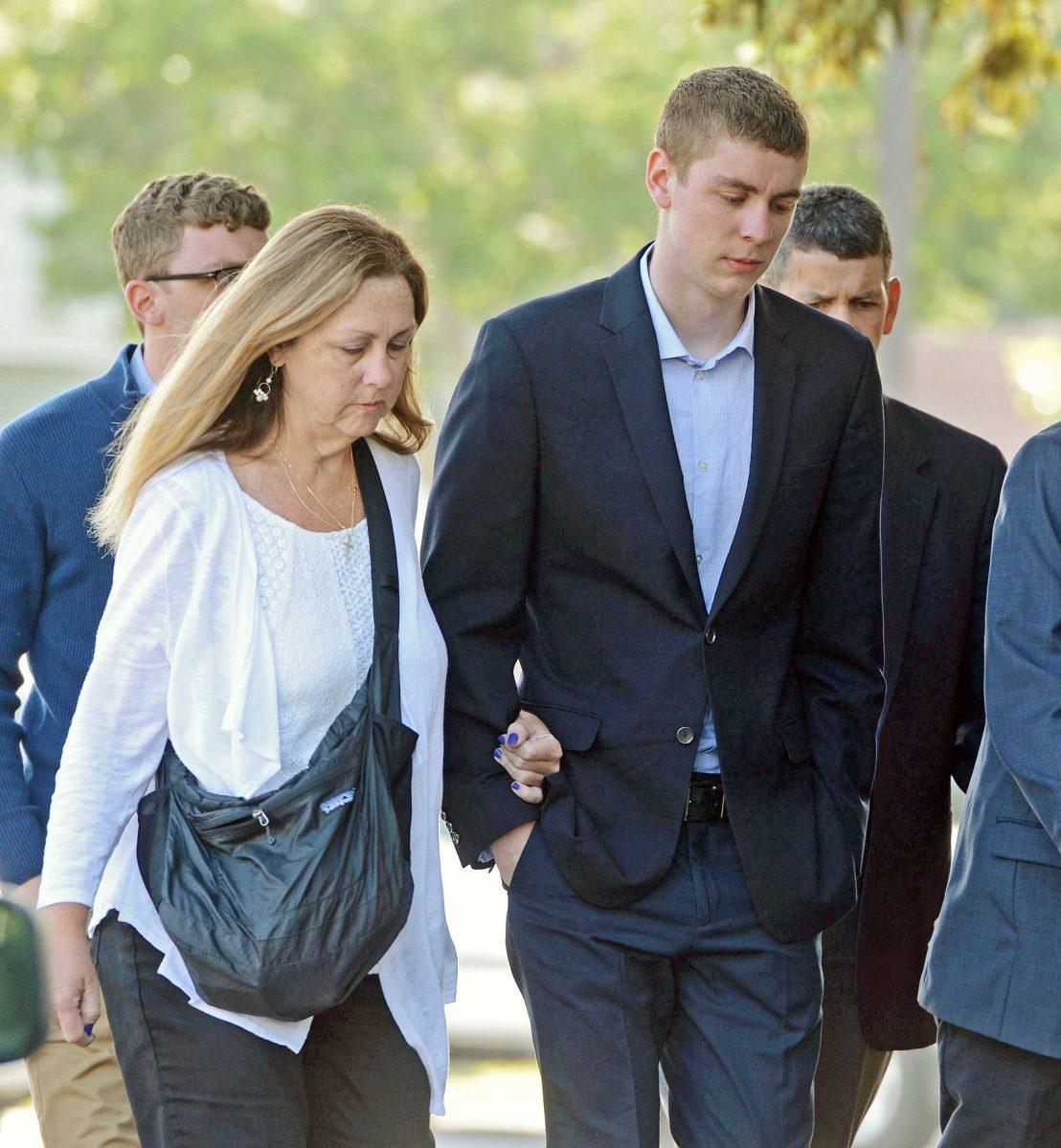 In this June 2, 2016 photo, Brock Turner, 20, right, makes his way into the Santa Clara Superior Courthouse in Palo Alto, Calif. The six-month jail term given to Turner, the former Stanford University swimmer who sexually assaulted an unconscious woman after both attended a fraternity party, is being decried as a token punishment. (Dan Honda/Bay Area News Group via AP) MAGS OUT NO SALES