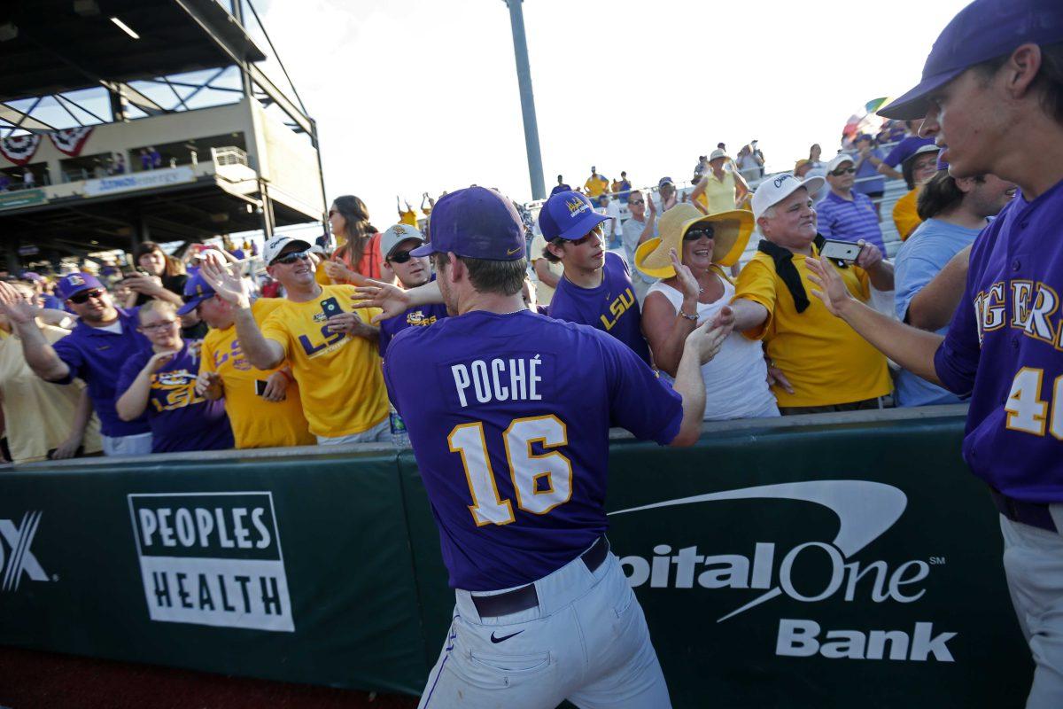 LSU pitcher Jared Poche' (16) celebrates with fans after defeating Rice in an NCAA college baseball tournament regional game in Baton Rouge, La., Tuesday, June 7, 2016. LSU won 5-2 to advance to the Super Regionals. (AP Photo/Gerald Herbert)