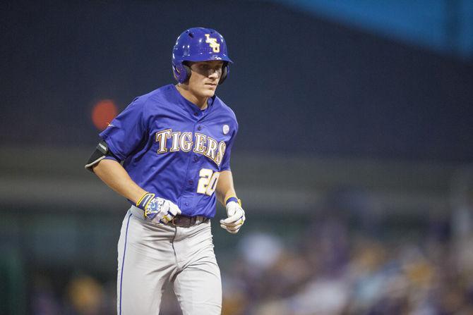 LSU freshman outfielder Antoine Duplantis (20) runs to the dugout after getting out during the Tigers' 4-3 loss against Coastal Carolina in the Super Regional on Sunday, June, 13, 2016 at Alex Box Stadium.