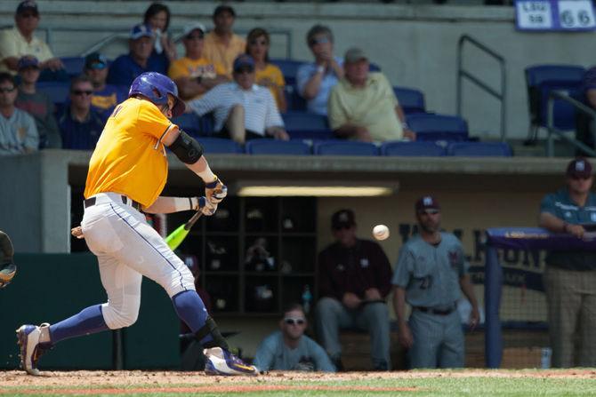 LSU sophmore infielder Greg Deichmann (7) bats during LSU's 11-8 victory on Sunday, April 24, 2016 at Alex Box Stadium