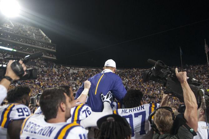 LSU coach Les Miles gets carried by his football players after the Tigers' 19-7 victory against Texas A&amp;M University on Saturday, Nov. 28, 2015 in Tiger Stadium.