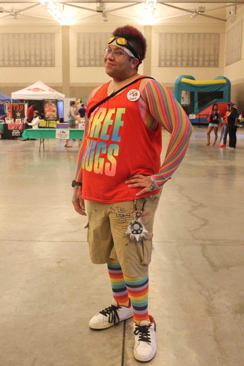 Festival goer Sergio Oramas poses in a 'Free Hugs' shirt at the Baton Rouge Pride Festival Saturday, June 11, 2016.